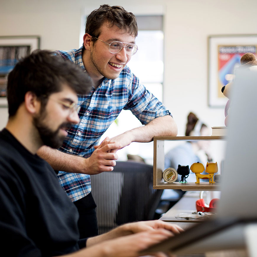 Alec and Josh working together at Alec's computer