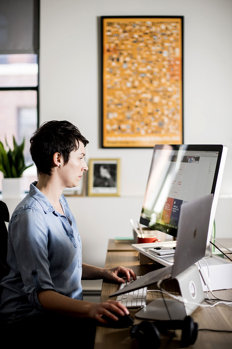 Kim works at her computer
