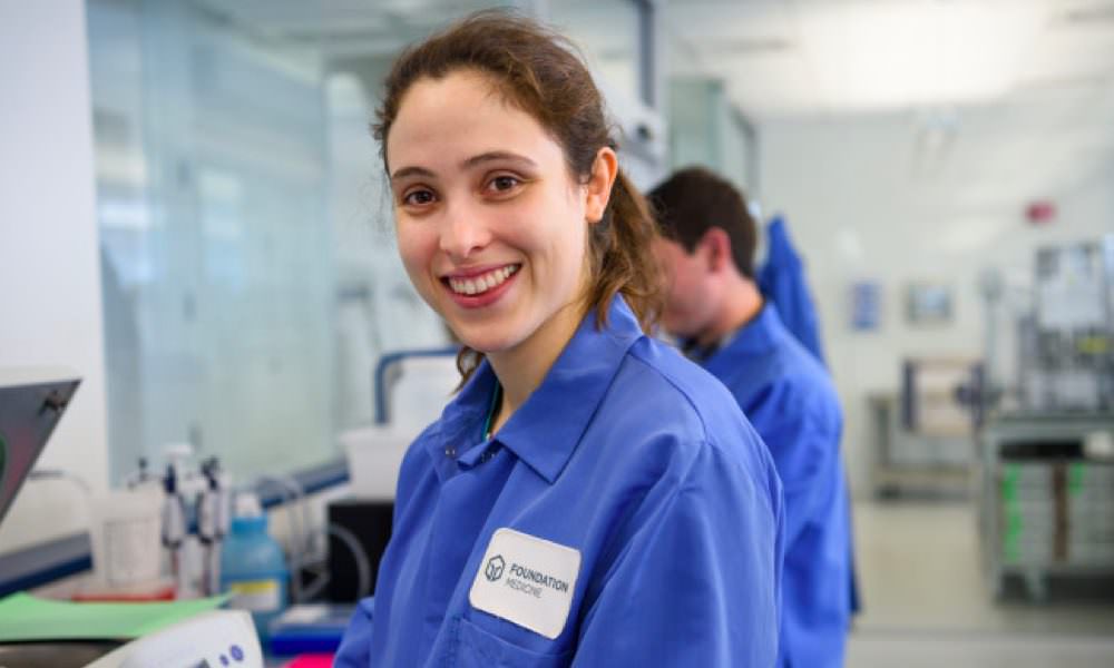 Lab tech smiling